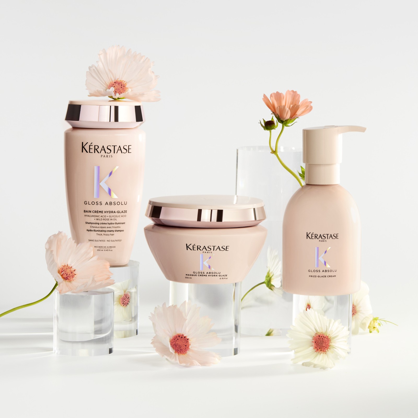 Kérastase Gloss Absolu kolekce luxusní péče o vlasy s květinovou dekorací